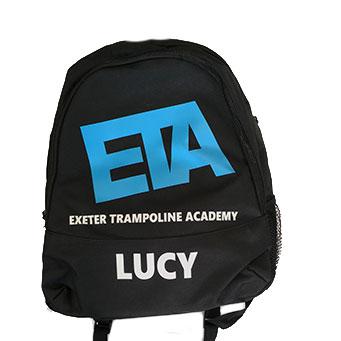 EXETER TRAMPOLINE ACADEMY Black backpack with blue ETA Print with Printed Name